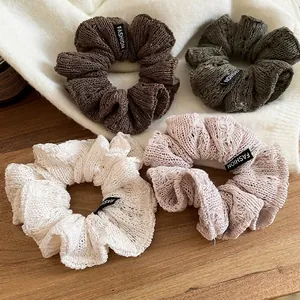 Set of 4 knitted scrunchies in coffee, olive green, cream white, and dusty pink colors