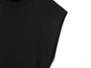 Detail view of the elegant black ribbed knit fabric on this sleeveless dress