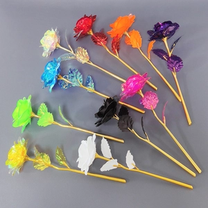 Detailed top view of artificial roses in nine vibrant colors with golden stems