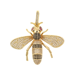 Exquisite gold honey bee pendant encrusted with clear, black, and red crystals detail
