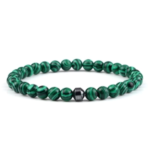 Macro detail of natural malachite beaded bracelet with a grey hematite octagon stone