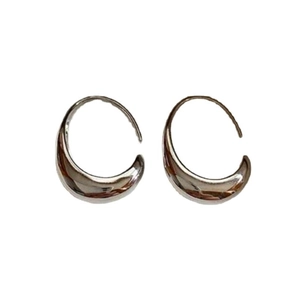 Polished silver teardrop hoop earrings for women with a minimalist metallic mirror finish