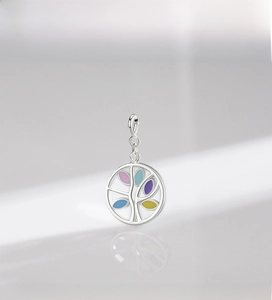 Macro view of S925 sterling silver Tree of Life pendant with colorful enamel details