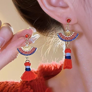 Chinese style red tassel earrings with golden fan design and pearl accents for women