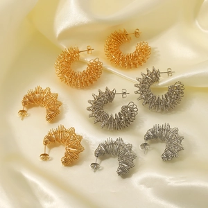 18k gold and silver plated stainless steel spiral spring earrings on silk fabric