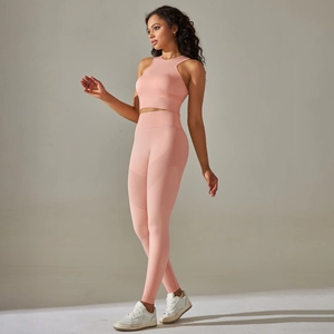 Detail of seamless dusty pink yoga set showing fabric texture and high-waisted fit