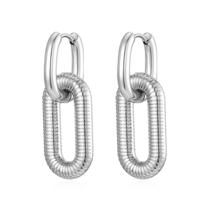 Polished silver interlocking oval hoop earrings with textured finish in studio lighting