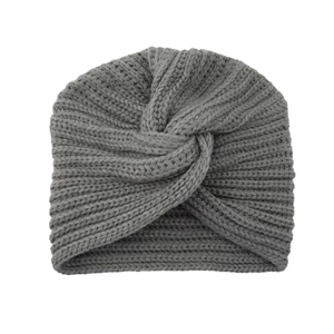 Detailed close-up of gray knit turban hat featuring a decorative bohemian cross knot design