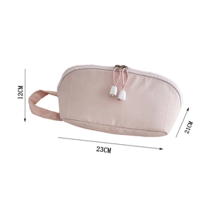 Pink cosmetic bag size details showing 23cm length by 21cm depth with double zippers