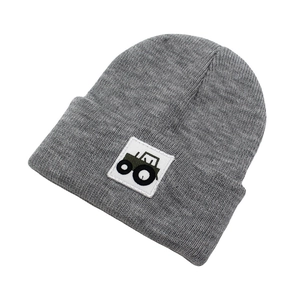 Close-up of grey ribbed knit beanie for kids featuring a green tractor patch embroidery