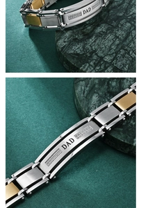 Detail of two-tone stainless steel DAD link bracelet with crystals on green marble base