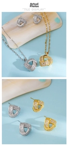Close-up of interlocking triple ring necklace and stud earrings set with pavé zircons