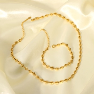 18K gold plated stainless steel O-link necklace and bracelet jewelry set on silk background