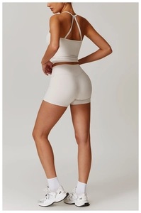 Detailed back view of high-waist cream white yoga set with racerback sports tank top