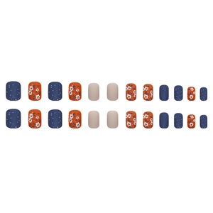 Short square press-on nails with blue glitter and orange floral designs on white background
