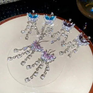 Sparkling zircon butterfly tassel drop earrings in blue, purple, and pink crystal finishes