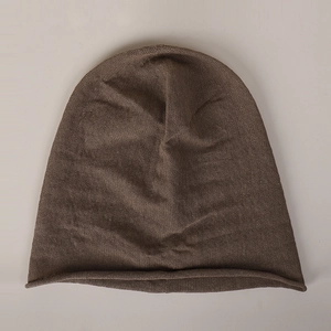 Close-up of the fine texture and rolled edge on this brown 100% linen knit beanie