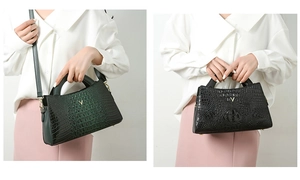 Detailed comparison of dark green and black crocodile texture handbags held by a model