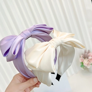 Elegant satin bow headband in purple and creamy white, stylish minimalist hair accessory
