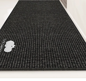 Detail of black anti-slip kitchen mat with vertical texture and cute elephant print