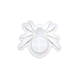 Top view of a spider-shaped silicone mold for DIY resin candles and Halloween crafts