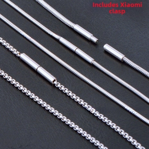 Detailed view of silver stainless steel snake and box chains with rice-shaped clasps