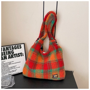 Close-up of the plush checkered tote bag showing rich texture and colorful wool fabric