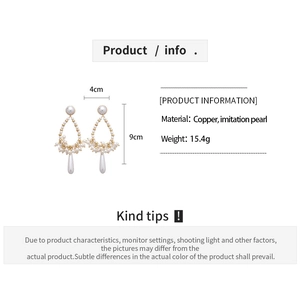 Detailed view of teardrop pearl earrings with dimensions 4cm wide and 9cm height