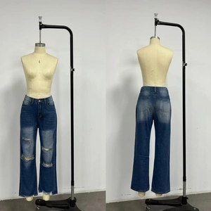 Detailed front and back views of high waist distressed denim jeans with frayed tassel hems
