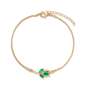 Detail of gold tulip bracelet with green gemstone inlay and sleek snake chain clasp