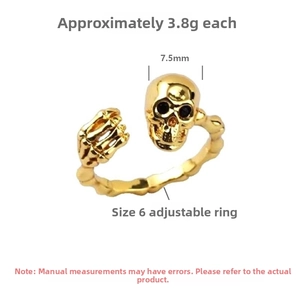 Macro shot of gold S925 sterling silver skull ring with bone texture band and adjustable design