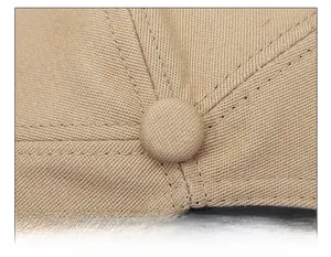 Détail macro de la couronne de casquette kaki avec coutures haute densité précises