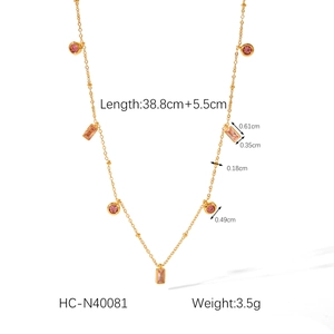 Detail view of 18K gold titanium necklace showing dimensions and pink zircon pendants