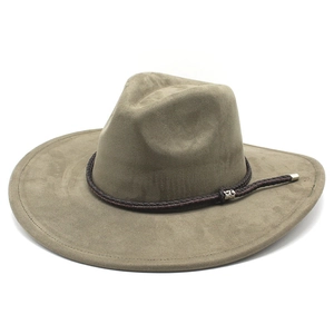 Detail of tan suede cowboy hat featuring dark brown braided rope with silver metal accents