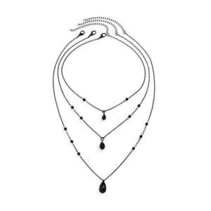 Detail of gothic black bead layered necklace set with teardrop crystal pendants