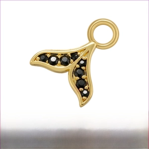 Detail view of gold mermaid tail charm with black zircon inlays and brass material specs