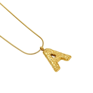 Initial letter A necklace with gold lava texture pendant on a snake chain for women
