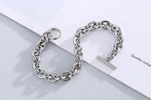 Detail view of silver stainless steel OT clasp bracelet with polished oval links