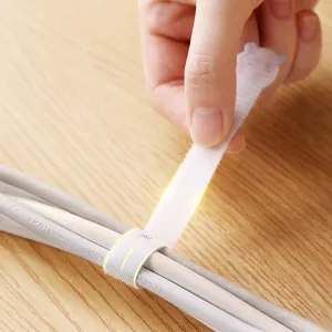 Reusable white velcro cable ties for desk management and organizing electrical cords