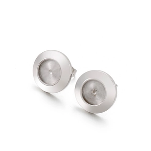 Close-up of silver round metal earring studs with recessed tray for DIY jewelry making