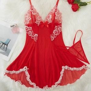 Red lace nightgown set with floral lace trim and mesh fabric on a plush background