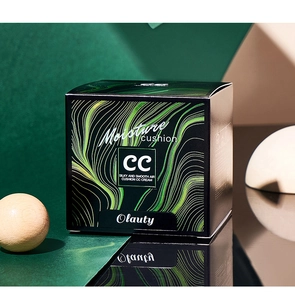 Detailed view of luxury moisture cushion CC cream in dark green box with wood decor
