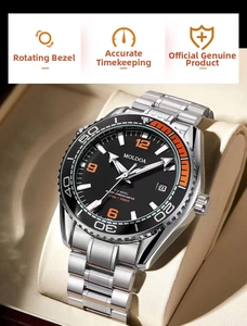 Detail of stainless steel diving watch with orange bezel markings on a beige cushion