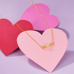 Macro shot of gold S925 sterling silver Mom necklace with heart shaped diamond pendant