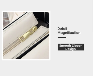 Detail magnification of smooth light gold zipper on white leather crossbody bag