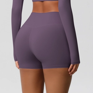 Detail shot of purple high-waist yoga shorts with V-line seam for lifting effects