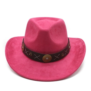 Detail of rose red suede cowboy hat with brown leather band and bronze metal studs