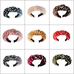 Detailed grid view of velvet knotted headbands with pearl beads in nine vibrant colors