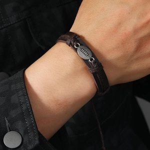Men's dark brown braided leather bracelet with rugby charm, casual vintage style