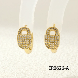 Detailed close-up of golden padlock earrings encrusted with sparkling clear zircons